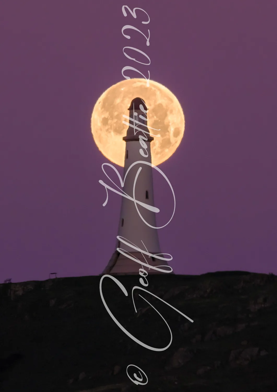 Full Moon setting behind Hoad monument, Ulverston.